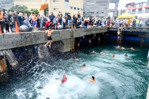 A group of people jump into the Wellington harbour