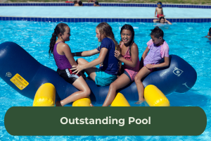 Four young girls sit on a pool inflatable with the copy overlaid 'Outstanding Pool'