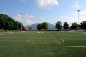 A sports field with mountains in the distance