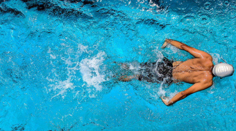 A man swims in a pool