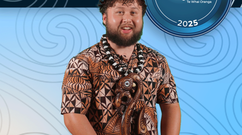 A man standing smiling. His hands are out of frame but look to be holding an ornately carved wooden award shaped like a taniwha. The background is a blue koru pattern with text at the top and bottom of the image. The top text says "2025 Recreation Awards Winner," and the bottom says "Te Mahi Ako Apprentice of the Year: Troy Hunter-Day"