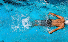 A man swims in the pool