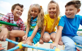Four kids play on a park