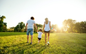 A family walk in a green space